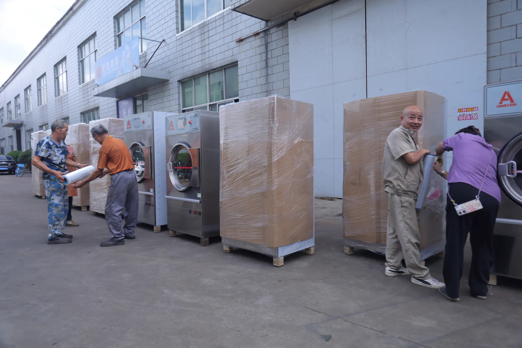 Laundry equipment being protected for shipment